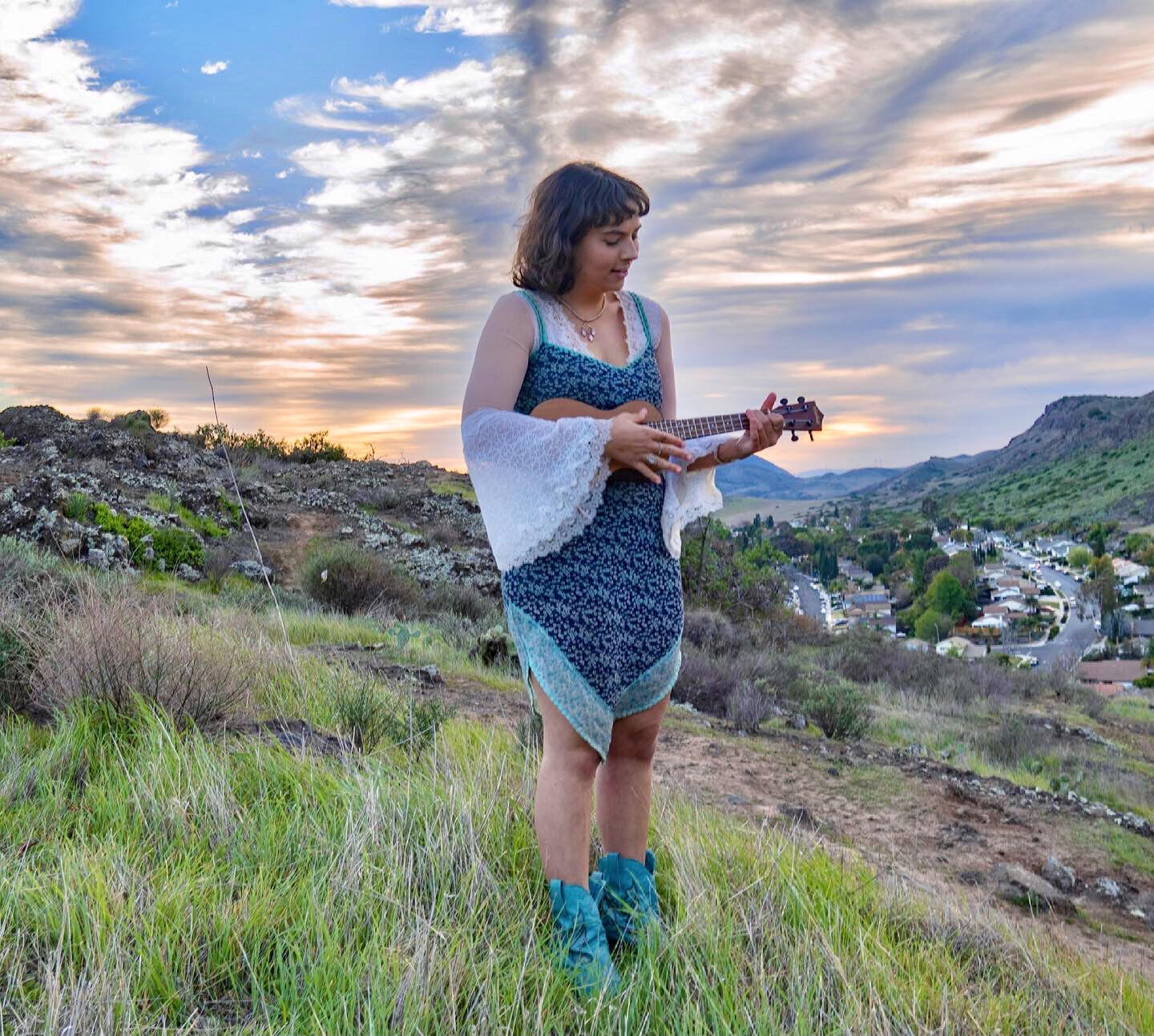 Rachael with ukulele on hill